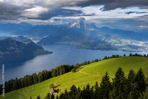 View from the top of Mount Rigi in Switzerland of a lake with the foreground lit by the morning sun