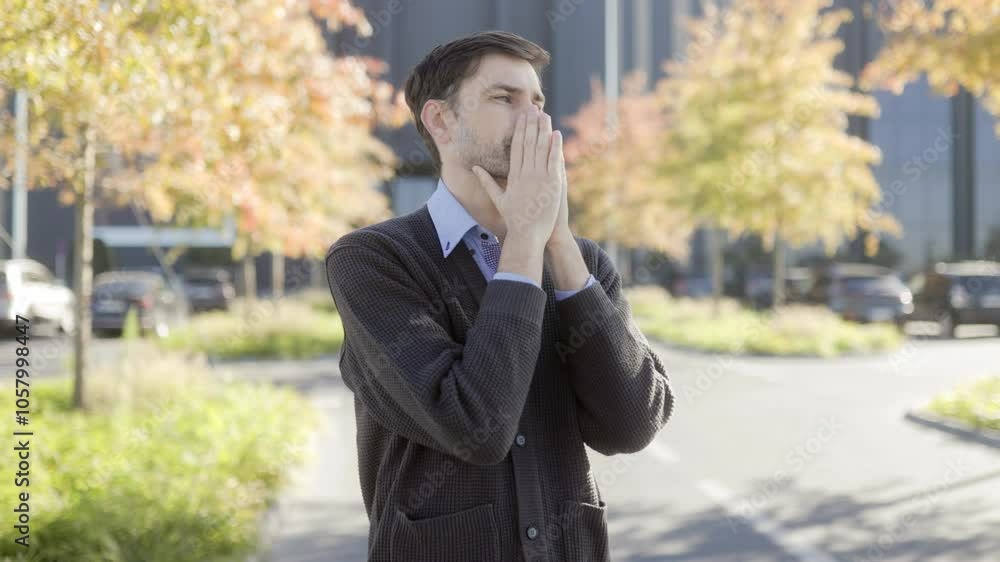 Tired Office Worker in Urban Setting Showing Signs of Stress and Fatigue Tired Office Worker in Urban Setting Showing Signs of Stress and Fatigue