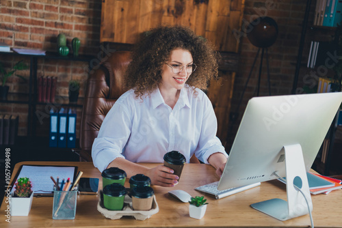 Photo of lovely curly young lady drink coffee working dressed formalwear business manager comfortable startup office room interior photo