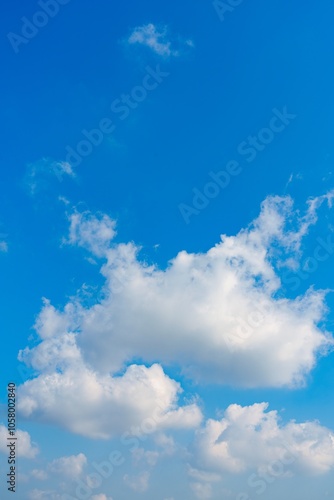 Wallpaper Mural This captivating stock image features a wide blue sky filled with fluffy white clouds. The serene atmosphere evokes tranquility and peace, making it perfect for relaxation and inspiration. Torontodigital.ca
