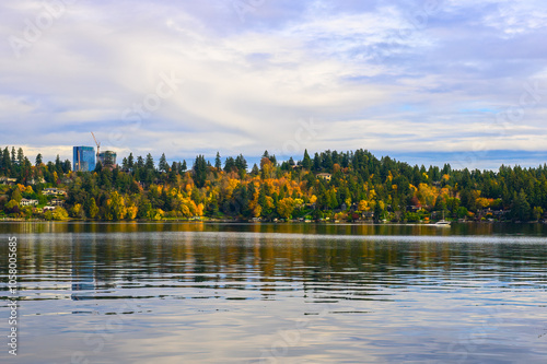 2024-1031 VIEW OF LAKE WASHINGTON AND THE BELLEVUE SHORELINE AND BUILDING IN DOWNTOWN WITH A CRANE AND CLOUDY SKY FROM MERCER ISLAND WASHINGTON- photo