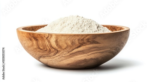 Heap of white flour in a round wooden bowl, creating a simple and rustic kitchen feel, isolated on white background