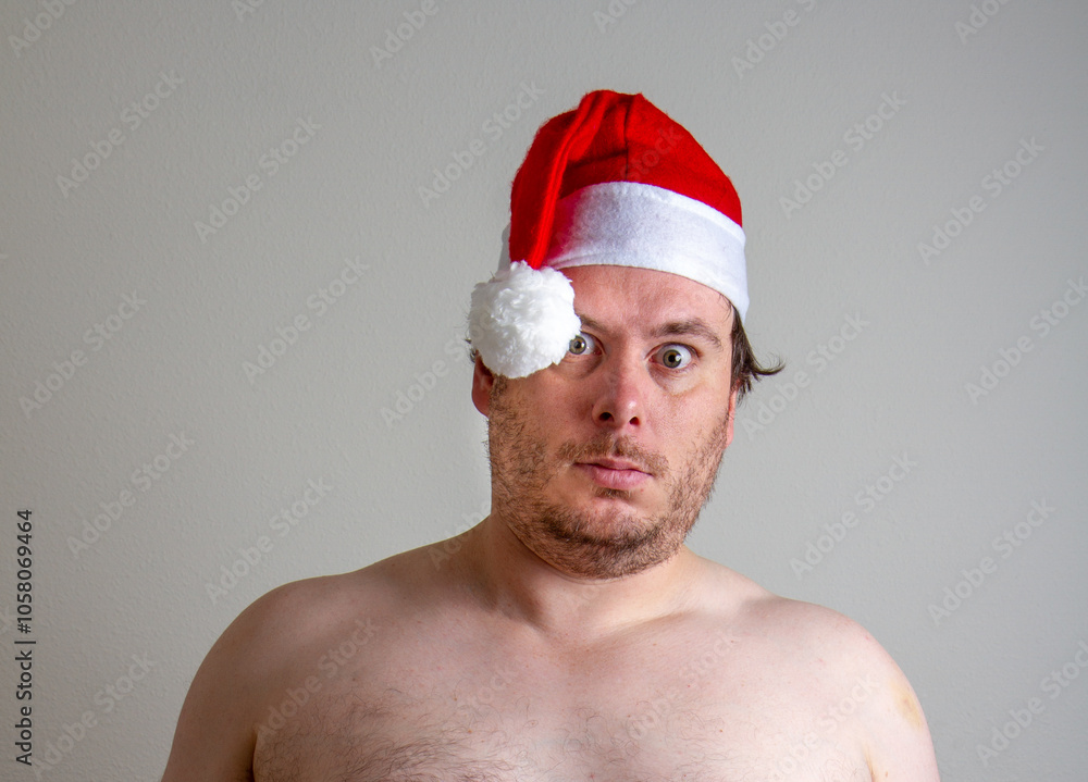 Man Wearing Santa Hat with Surprised Expression Man Wearing Santa Hat with Surprised Expression