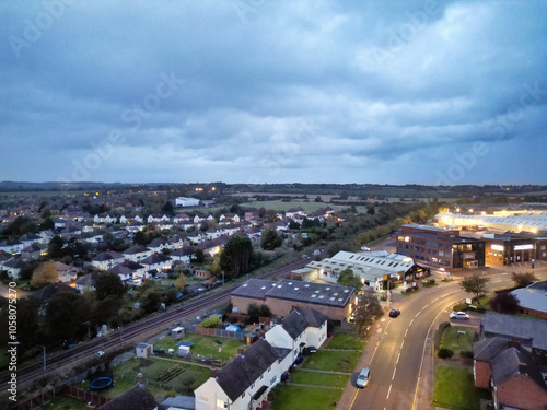 Aerial Footage of Illuminated Residential District Homes at Central Hitchin Town of England Great Britain. The Footage was Captured with Drone's Camera on October 28th, 2023 During Night.