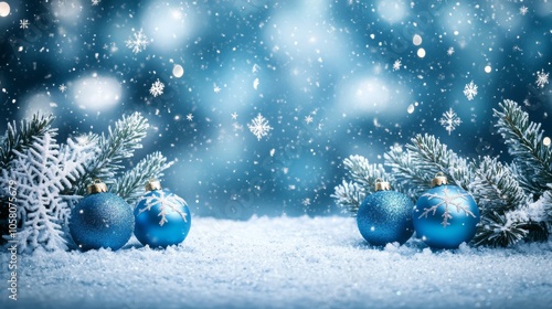 Christmas - Blue bauble on snow with fir branches