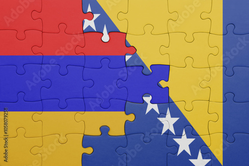 puzzle with the colourful national flag of armenia and flag of bosnia and herzegovina .