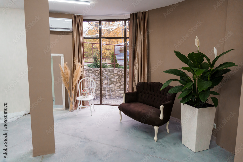 Fototapeta premium Cozy Modern Lounge Space with Natural Light and Elegant Decor