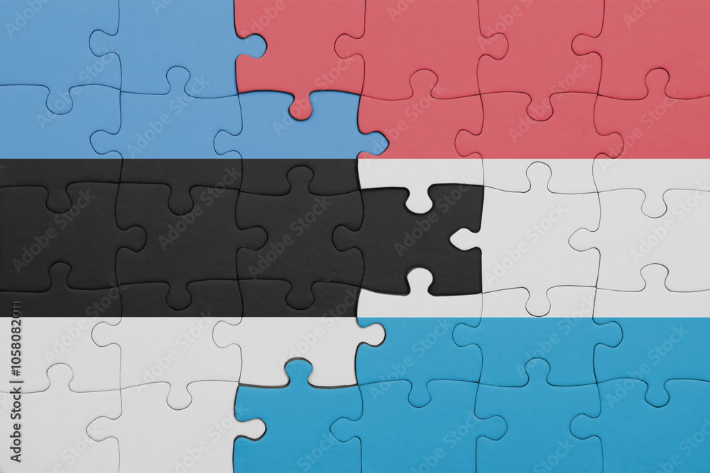 puzzle with the colourful national flag of estonia and flag of luxembourg . puzzle with the colourful national flag of estonia and flag of luxembourg .
