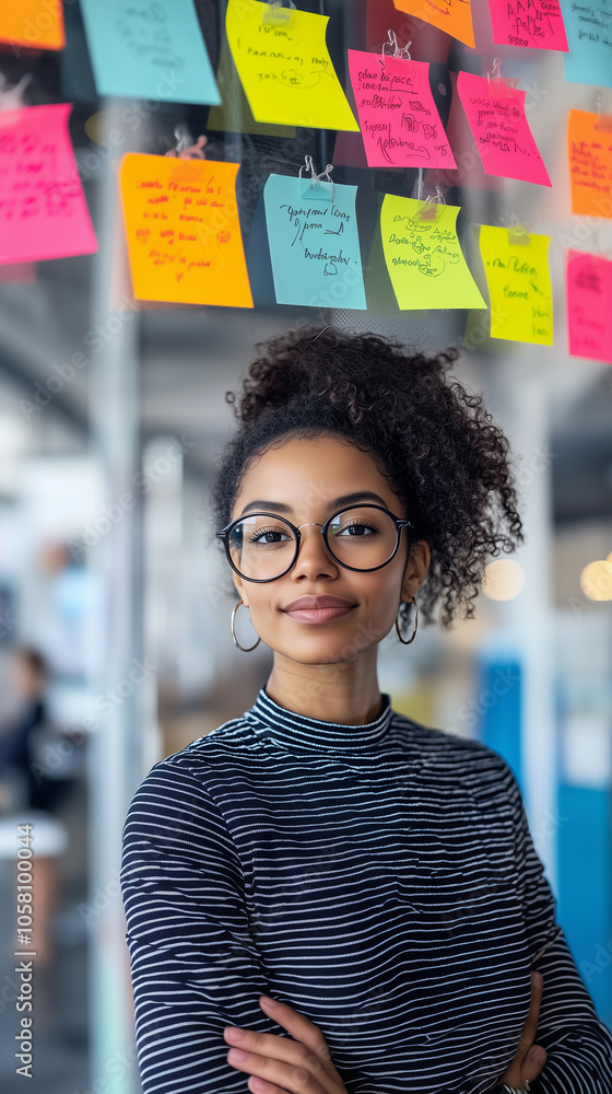 a portrait of a happy brunette woman with glasses in a coworking office with a modern branding background