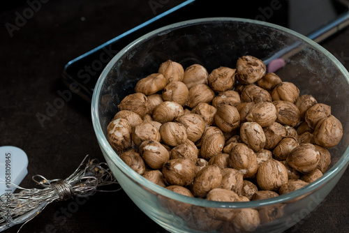 Bowl of Raw Sacha Inchi Seeds on a Dark Table photo