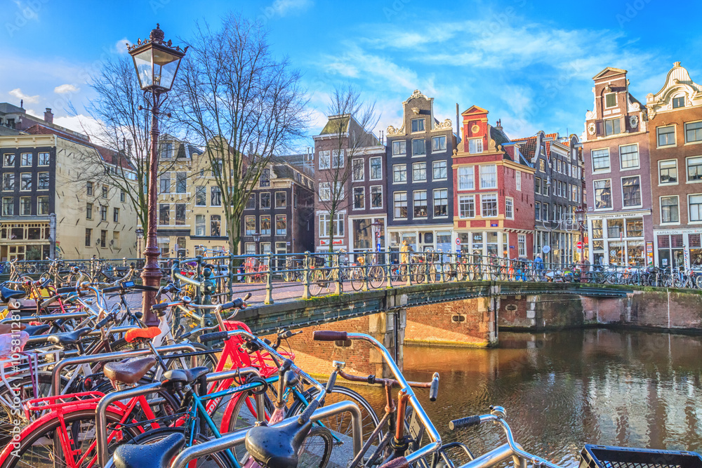 Cityscape on a sunny winter day - view of the bike parking in the historic center of Amsterdam, The Netherlands