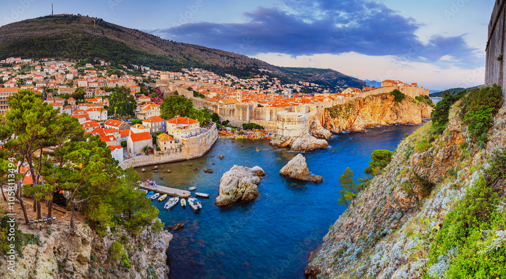 Evening view of the Old Town of Dubrovnik from the side of Fort Lovrijenac, panorama, banner, on the Adriatic coast of Croatia Evening view of the Old Town of Dubrovnik from the side of Fort Lovrijenac, panorama, banner, on the Adriatic coast of Croatia