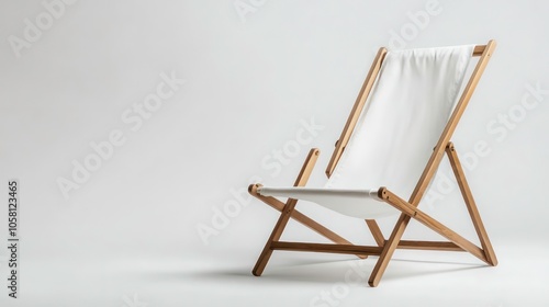 A white wooden deck chair with a white fabric seat on a plain white background.