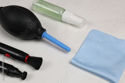 a set of camera lens cleaning tools isolated on white