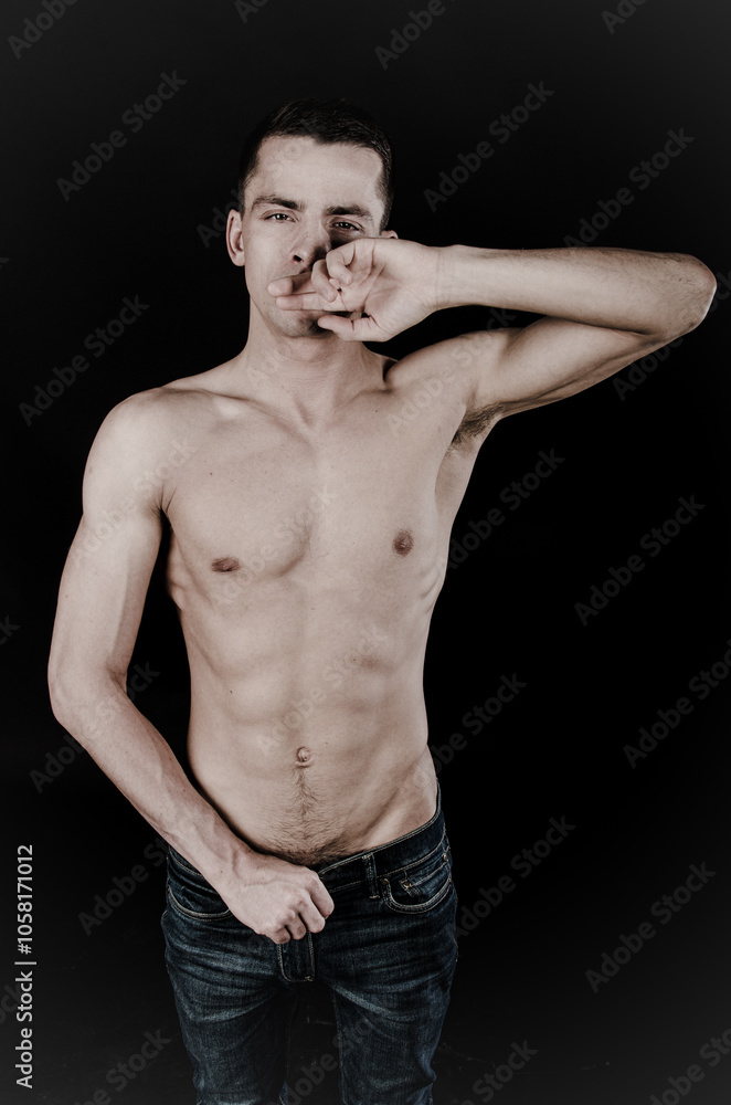 Young attractive man with athletic body posing in studio. Young attractive man with athletic body posing in studio.