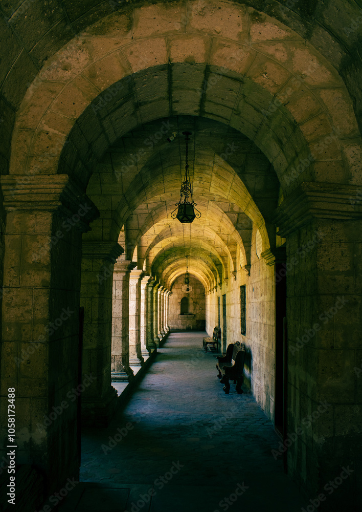 Obraz premium corridor inside the monastery illuminated by natural light