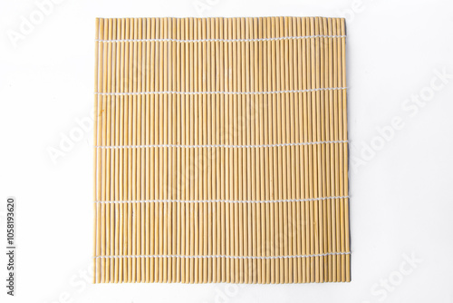 The sushi rolling tool is called makisu or rolling mat for background