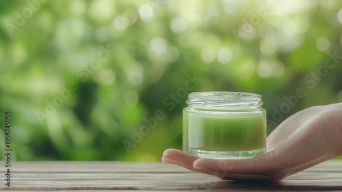 Aloe vera gel application on fresh bite, green natural surroundings photo