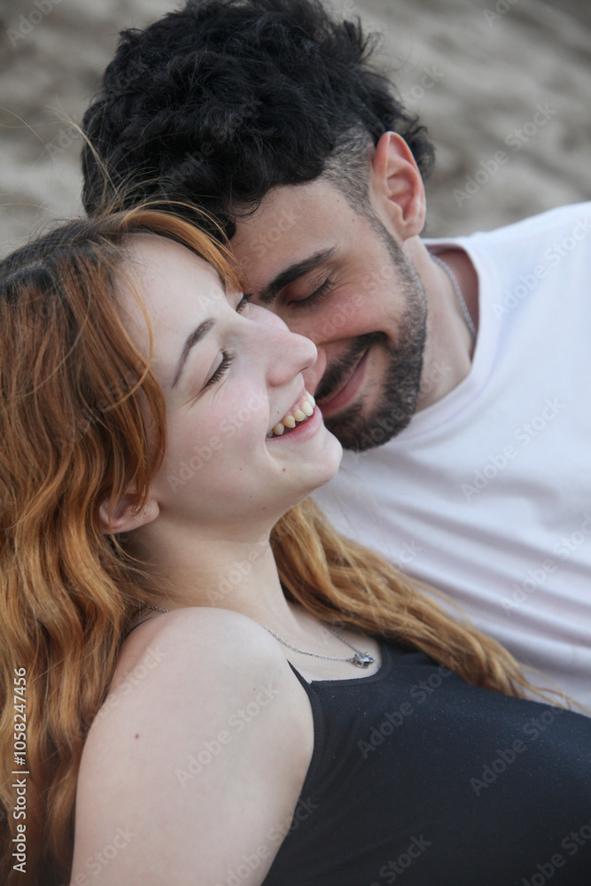 Fototapeta premium closeup portrait of cute loving young couple on the beach