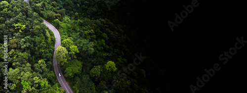 Quadro su tela Rainforest road curve construction up to mountain , Road in the middle of the forest Concept of using electric cars to protect the environment and transportation