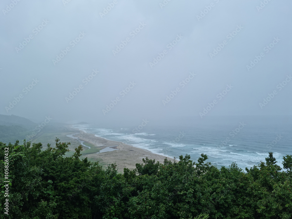 It is a foggy seascape. It is a foggy seascape.