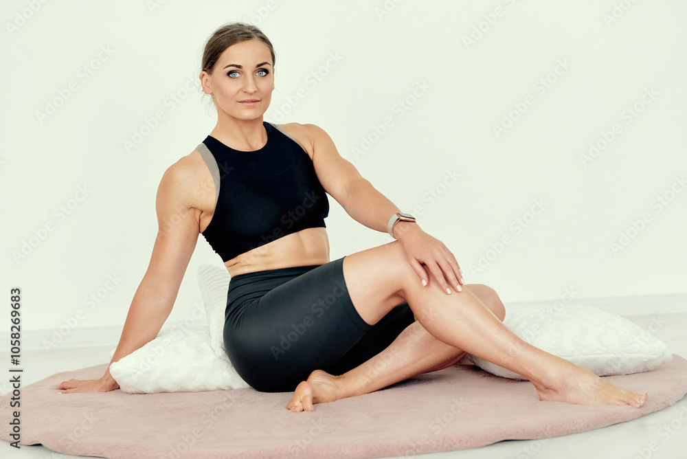 Relaxed Fitness Trainer Resting on Cushions. Relaxed Fitness Trainer Resting on Cushions.