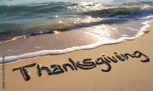 the word thanksgiving written on sand of beach