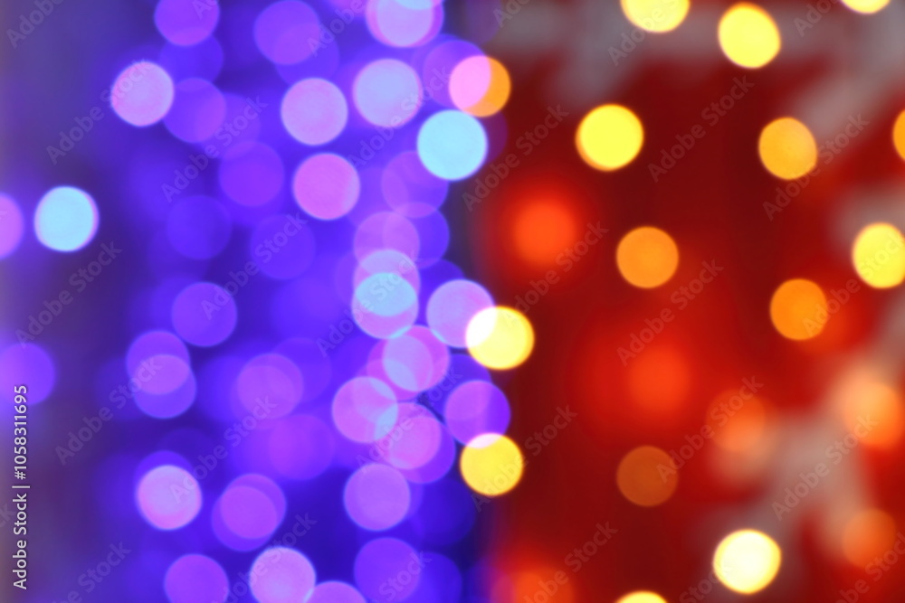 Fototapeta premium Many soft blue, purple, orange, red and yellow blurry bokeh light in Christmas and New Year festival day, can use for background
