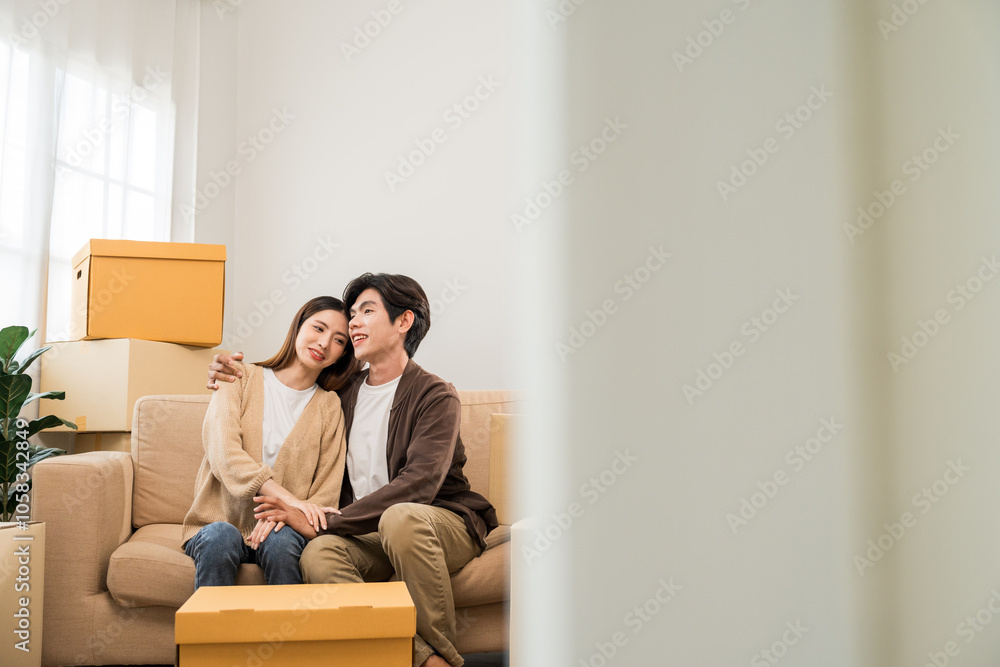 Couple asian family buying new house. Happy moment man and woman getting new home moving parcels into the house and decorate Moving relocation with lot of parcel box cardboard Couple asian family buying new house. Happy moment man and woman getting new home moving parcels into the house and decorate Moving relocation with lot of parcel box cardboard