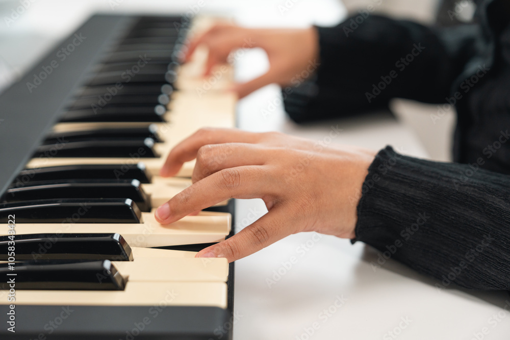 Fototapeta premium Professional Musician with condenser microphone and tablet for Mixing Mastering music. Music composer woman composing a song with guitar and piano keyboard at digital Recording home studio