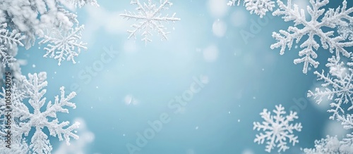 Delicate snowflake frame on a winter-themed backdrop with space for text.