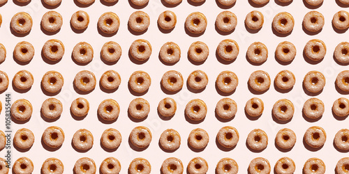 A seamless pattern of donuts, each with its shadow, scattered across the canvas in an elegant display, with soft shadows on a soft pale pink color background