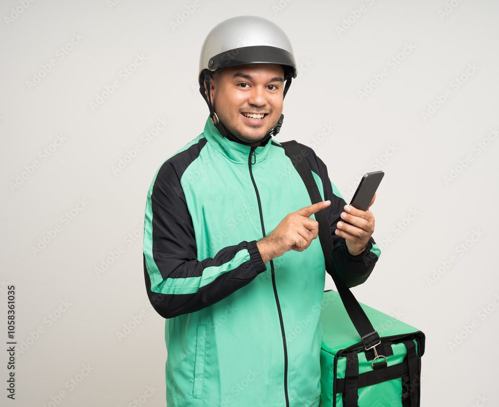 Young asian rider wearing green jacket uniform and helmet various action holding a lot of paper parcel delivery box to customer. Man service worker Courier and shipping food delivery service. Young asian rider wearing green jacket uniform and helmet various action holding a lot of paper parcel delivery box to customer. Man service worker Courier and shipping food delivery service.
