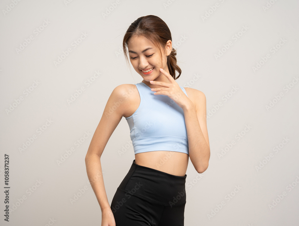 Young beautiful smiling asian woman with sportswear on isolated white background. Portrait happy healthy slim fit and firm attractive sporty woman standing pose exercise workout in studio. Young beautiful smiling asian woman with sportswear on isolated white background. Portrait happy healthy slim fit and firm attractive sporty woman standing pose exercise workout in studio.