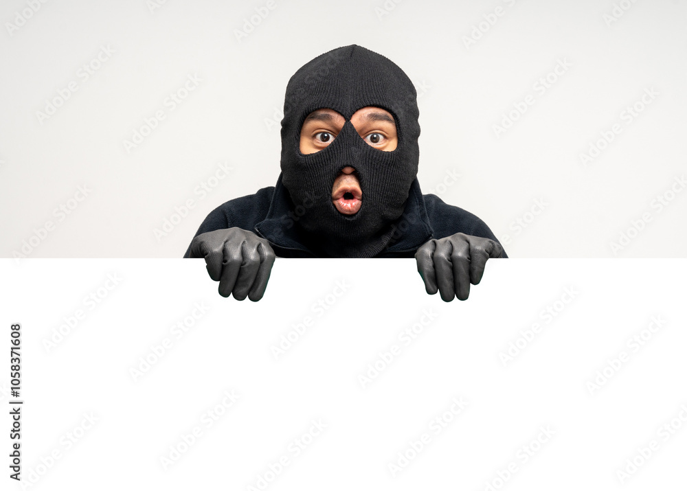 Thief in uniform black jacket various pose on isolated background. The Robber terrorism criminal escapes with balaclava and crowbar entering a house for stealing Housebreak Thief in uniform black jacket various pose on isolated background. The Robber terrorism criminal escapes with balaclava and crowbar entering a house for stealing Housebreak