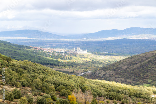 Royal Monastery of San Lorenzo de El Escorial, seen through the fog, from the Cruz Verde mountain pass