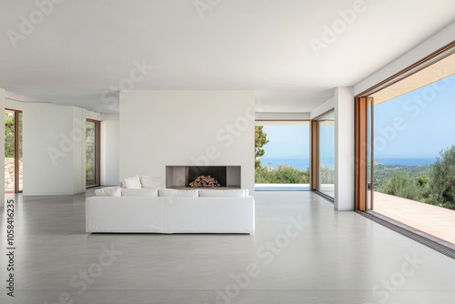 Modern minimalist living room with a stunning coastal view in bright daylight