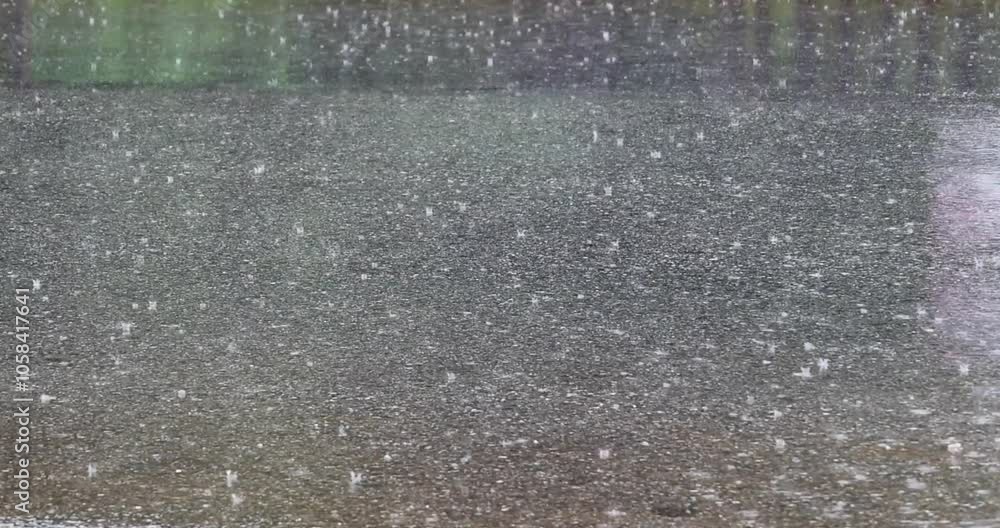 Raindrops hit the road, recorded with a professional 4K high-definition camera in Myanmar.