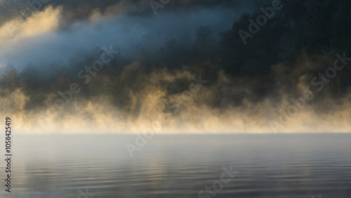 Mountain foggy lake in mist