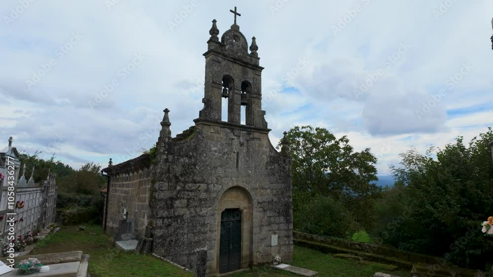 Stone facade and bell tower of Santa María de Ucelle church in Coles, Ourense, Galicia, Spain Stone facade and bell tower of Santa María de Ucelle church in Coles, Ourense, Galicia, Spain
