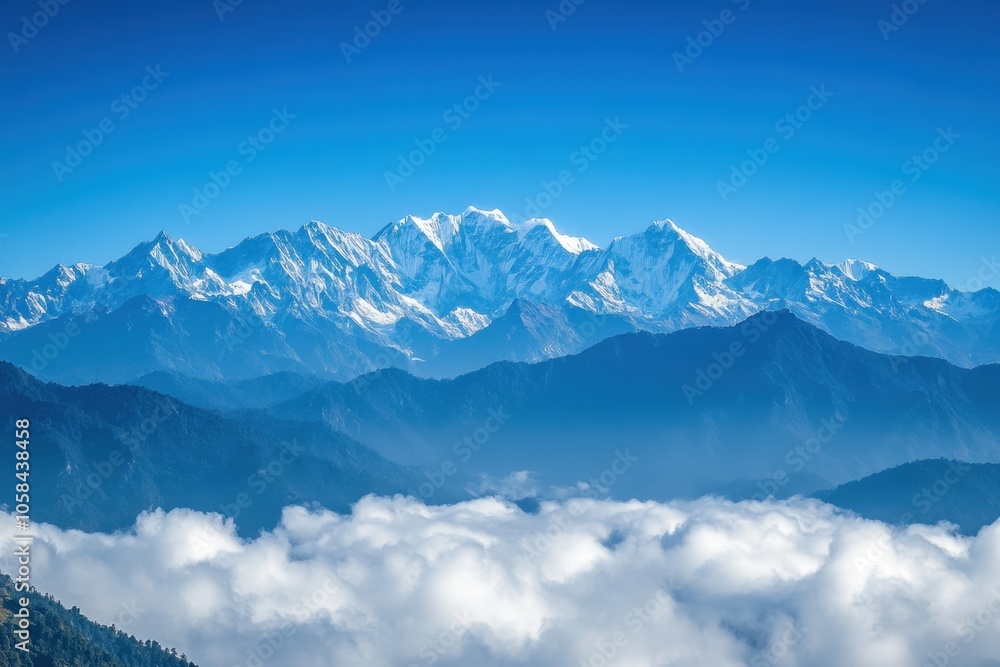 A stunning mountain range with peaks piercing through a blanket of clouds, capturing the majesty and grandeur of the landscape under a crisp, clear blue sky, creating a breathtaking vista. A stunning mountain range with peaks piercing through a blanket of clouds, capturing the majesty and grandeur of the landscape under a crisp, clear blue sky, creating a breathtaking vista.