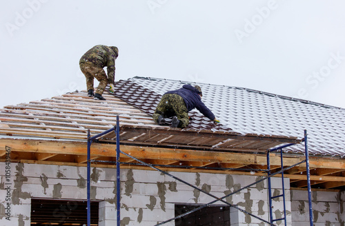 Wallpaper Mural Two men are working on a roof in the snow Torontodigital.ca