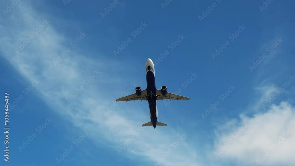 A plane glides across a bright blue sky, symbolizing the excitement of air travel. This scene embodies adventure and freedom, perfect for themes of journey and escape. A plane glides across a bright blue sky, symbolizing the excitement of air travel. This scene embodies adventure and freedom, perfect for themes of journey and escape.