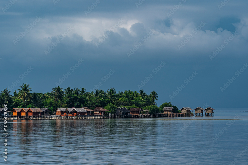 stilt houses on small island in Raja Ampat stilt houses on small island in Raja Ampat