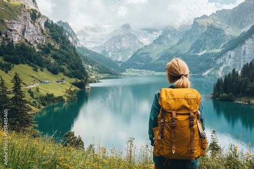 Tourist enjoying breathtaking seealpsee lake and alpstein mountains landscape in switzerland photo