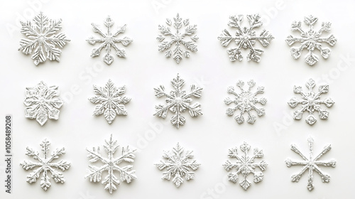 white snow flakes in different shape on white background