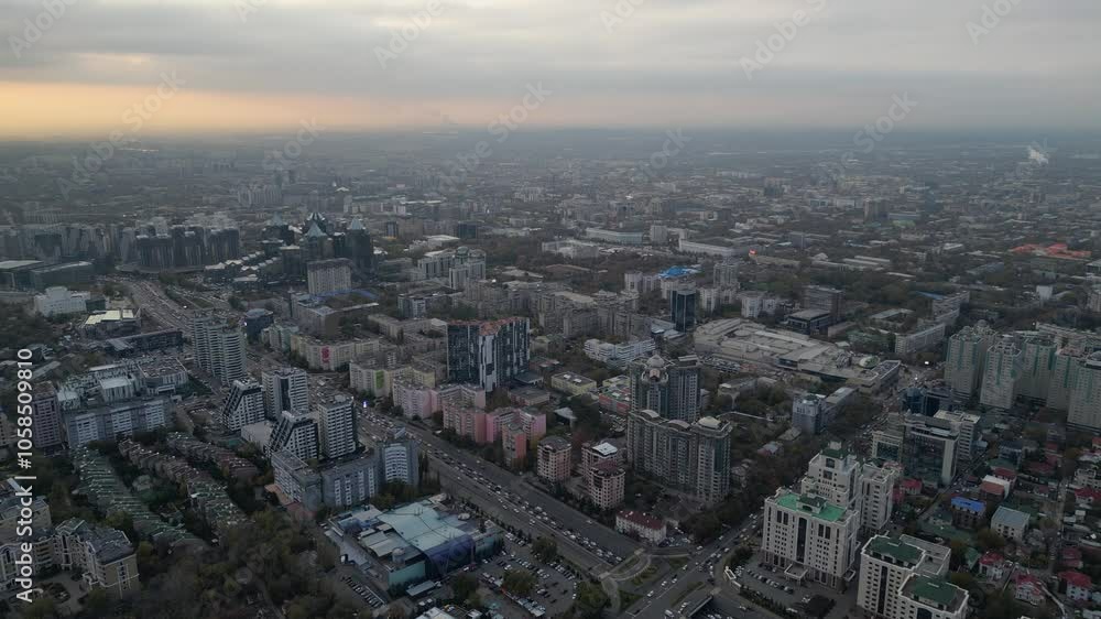 View of the city, with different buildings and streets. Sunset time. Autumn. The view from the drone. View of the city, with different buildings and streets. Sunset time. Autumn. The view from the drone.