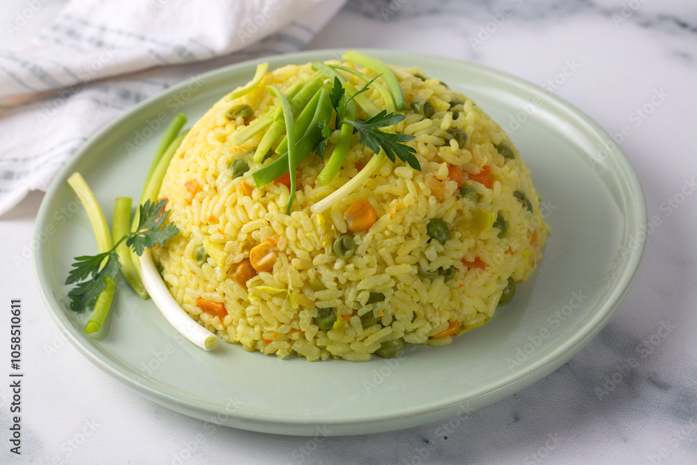 Top view of a bowl with fried rice with vegetables, onion, bell pepper, carrot, green peas. Vegetarian food served Top view of a bowl with fried rice with vegetables, onion, bell pepper, carrot, green peas. Vegetarian food served