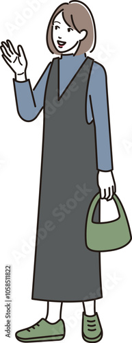 手を振る若い女性