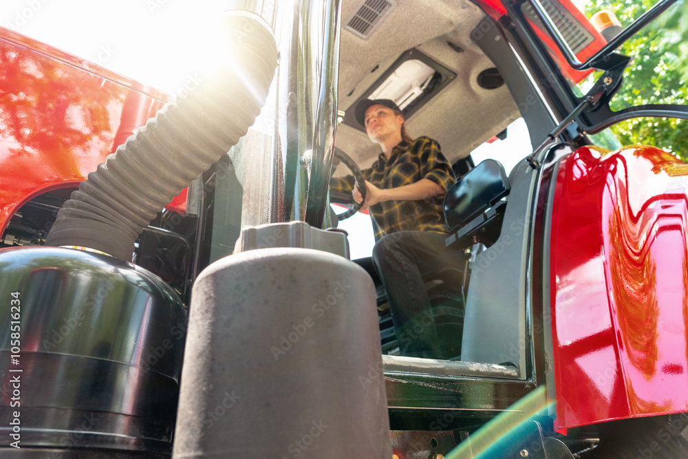 custom made wallpaper toronto digitalCab of a farm or construction tractor with a blurred female driver inside.